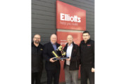 Elliotts receives commemorative trophy