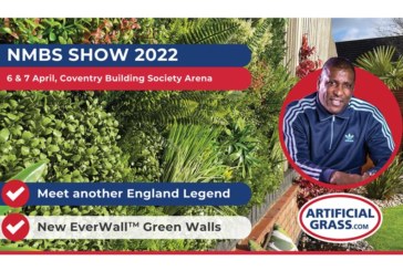 Viv Anderson signs for ArtificialGrass.com at NMBS Exhibition