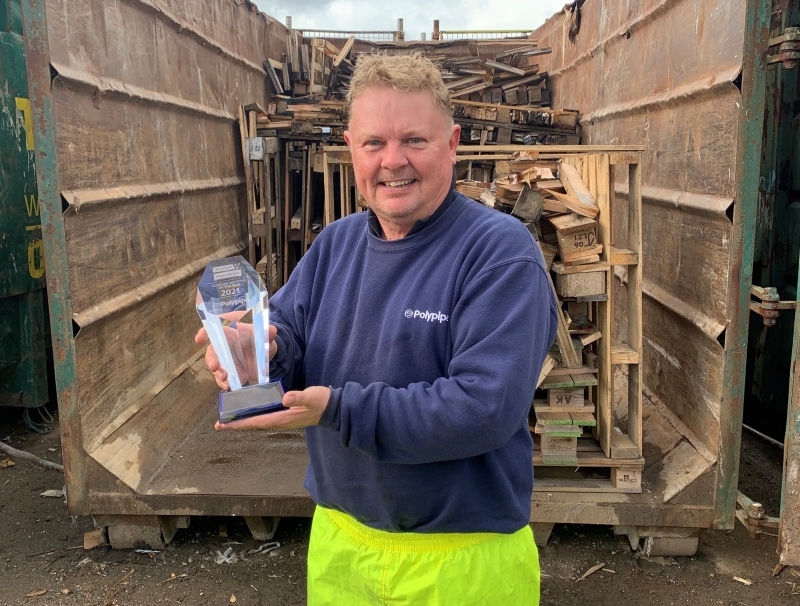 Polypipe Building Services recycling operative Paul Knight with the Recycling Award from Wolseley.