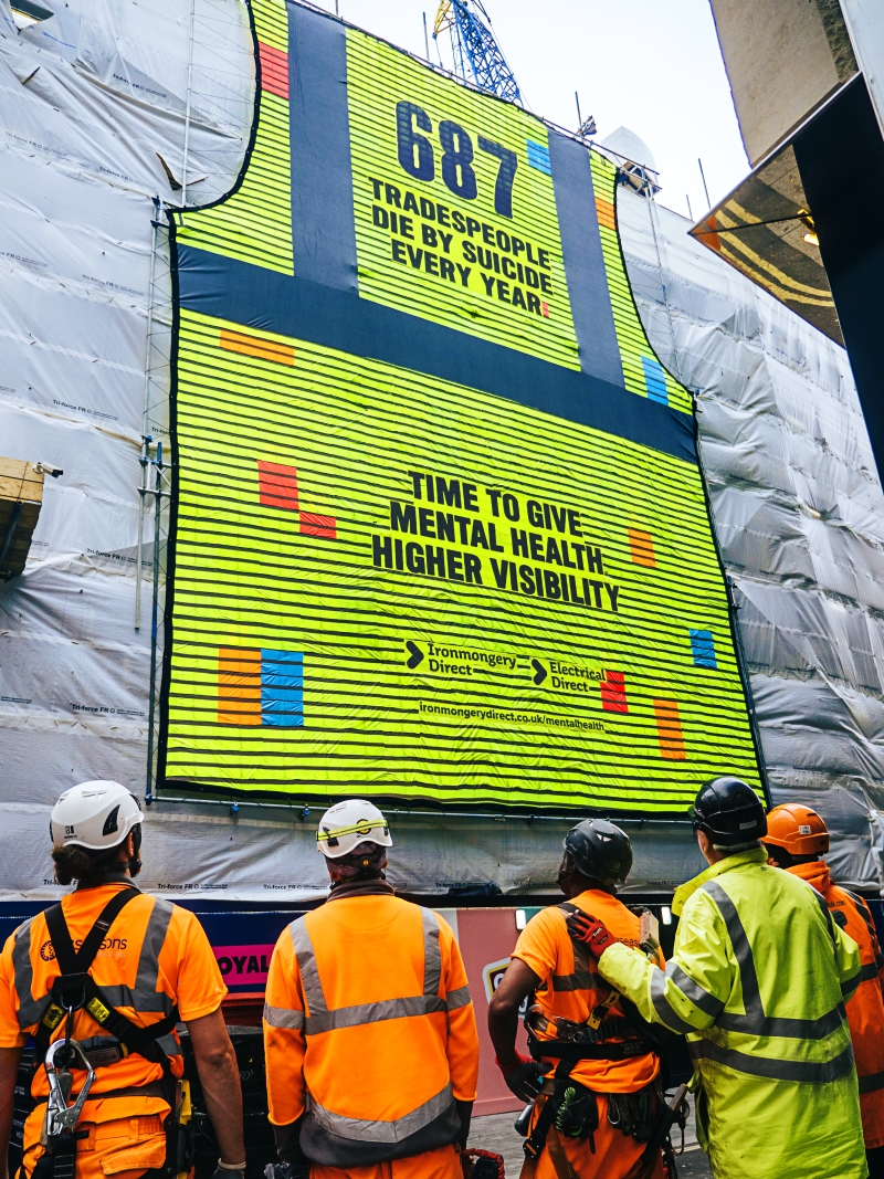 A giant piece of artwork made up of 687 high-vis vests - created for Mental Health Awareness Week (15th-21st May) by IronmongeryDirect and ElectricalDirect - has been displayed on a London construction site to represent the annual number of trade suicides in the UK.